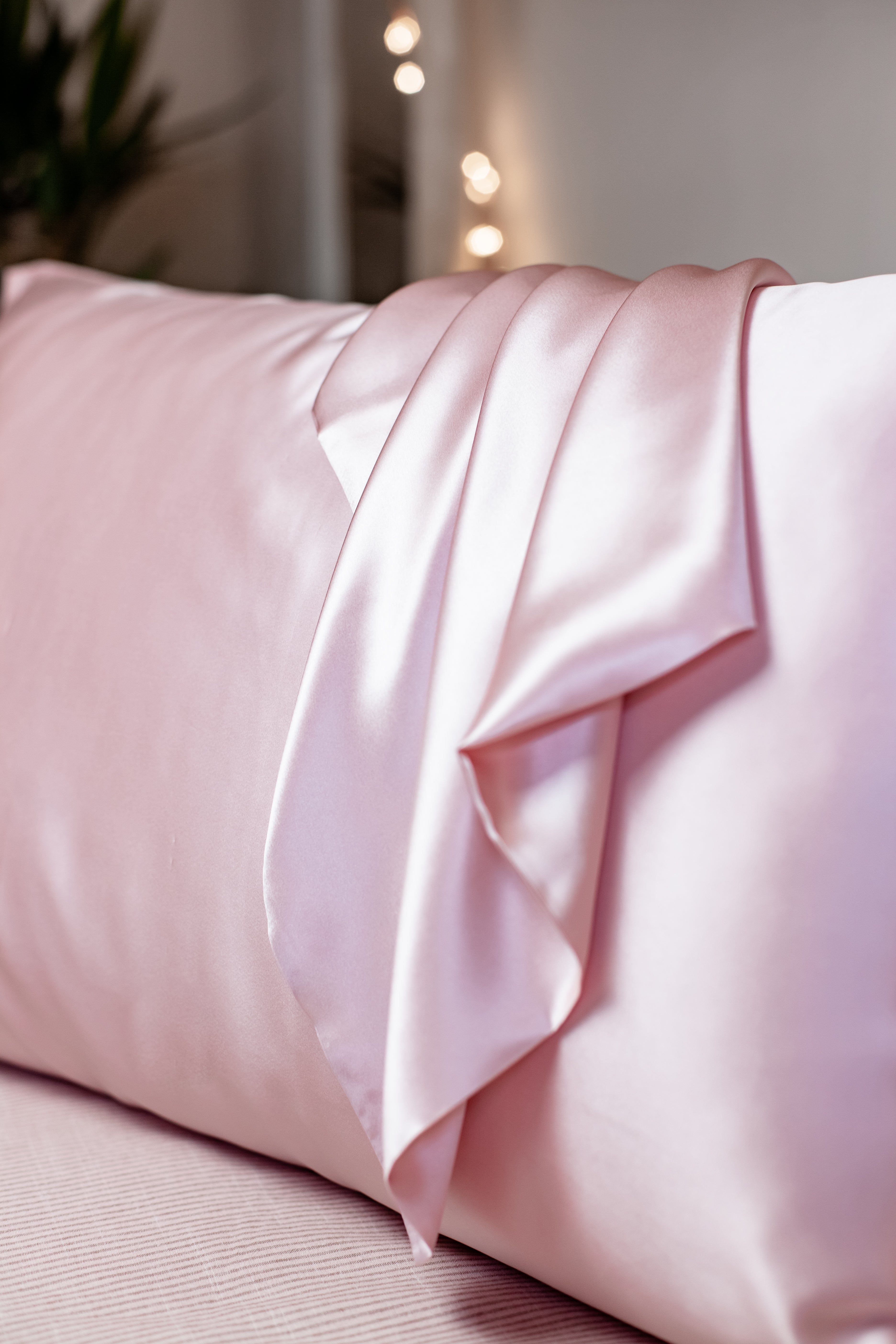Soft pink silk pillowcase for smooth skin, healthy hair, and luxurious sleep
