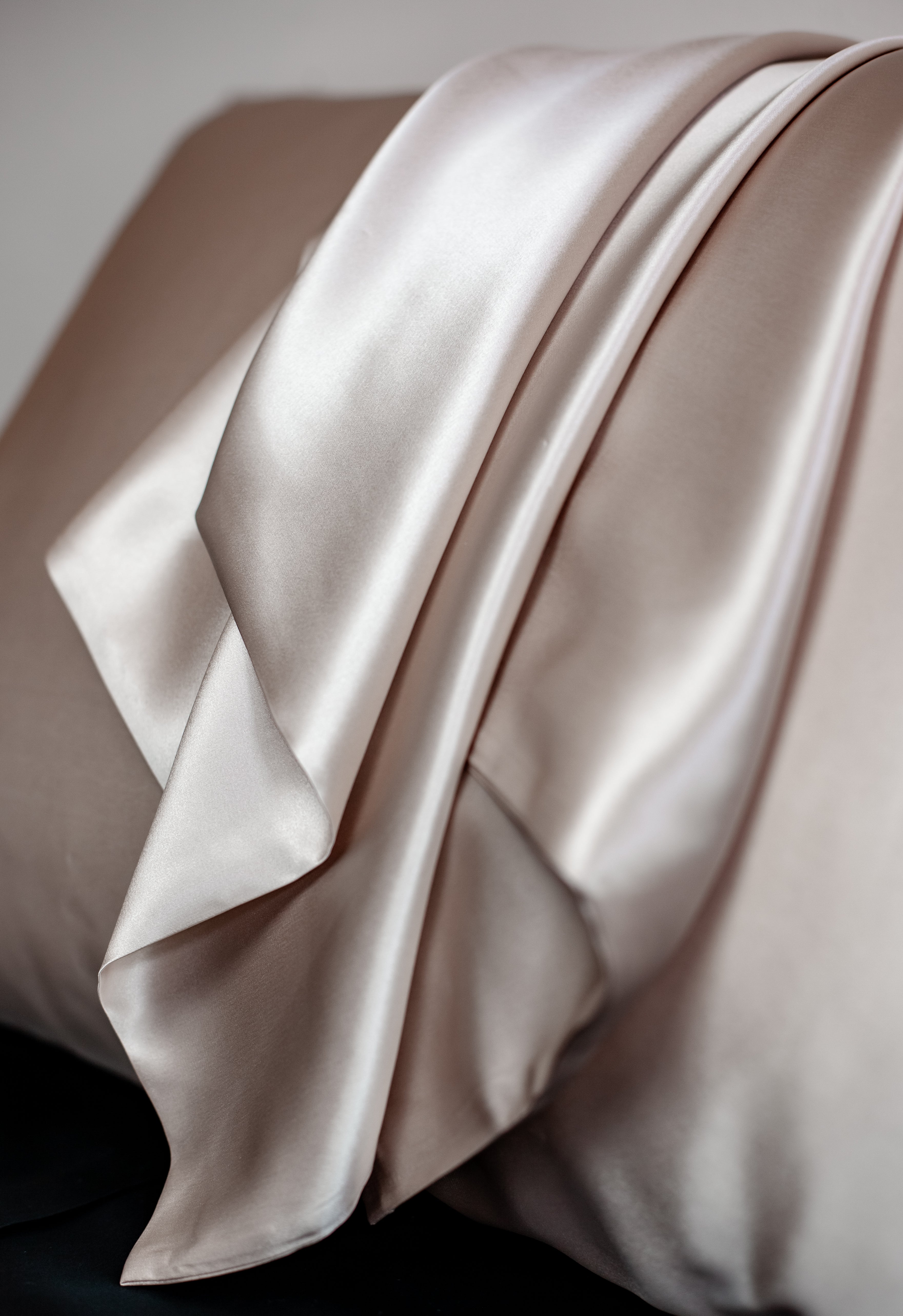 Beige silk pillowcase for luxurious and smooth bedtime comfort
