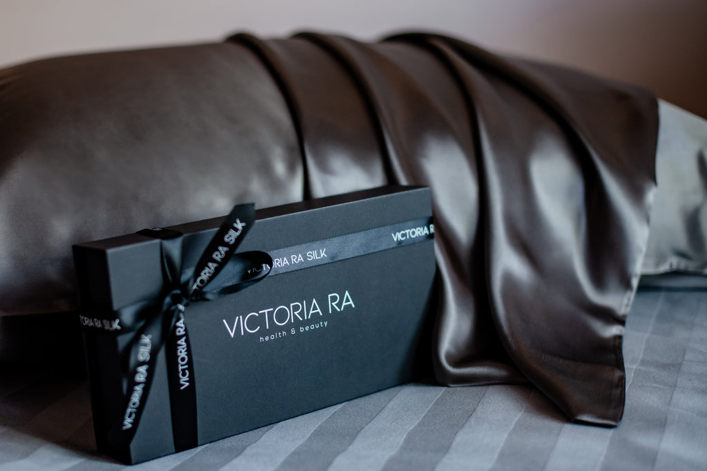 Grey silk pillowcase for hair protection and comfortable sleep
